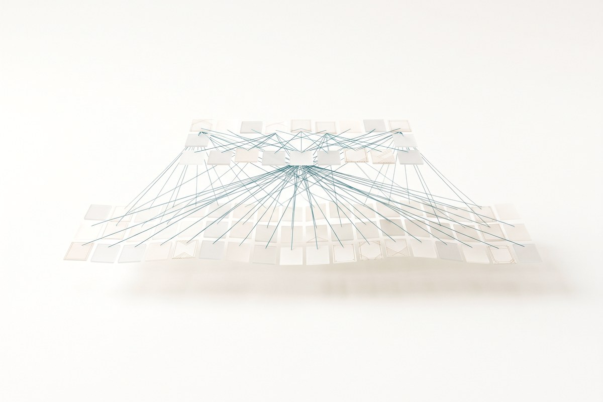 Abstract illustration of two layers of cards with threads between them